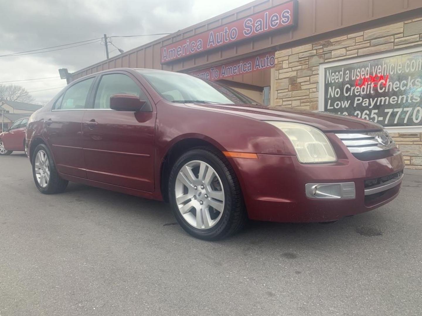 2006 RED FORD FUSION SEL (3FAHP08186R) with an 3.0L engine, 6-Speed Manual transmission, located at 2514 Williamson Rd NE, Roanoke, VA, 24012, (540) 265-7770, 37.294636, -79.936249 - Photo#0