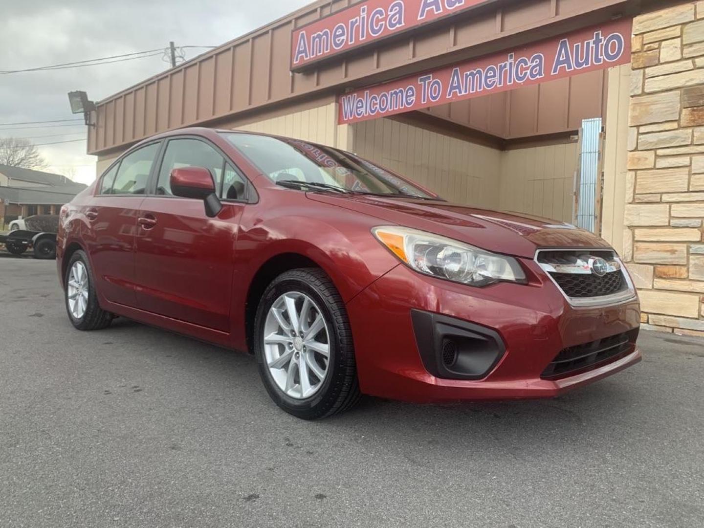 2012 RED SUBARU IMPREZA PREMIUM (JF1GJAB61CH) with an 2.0L engine, Continuously Variable transmission, located at 2514 Williamson Rd NE, Roanoke, VA, 24012, (540) 265-7770, 37.294636, -79.936249 - Photo#1