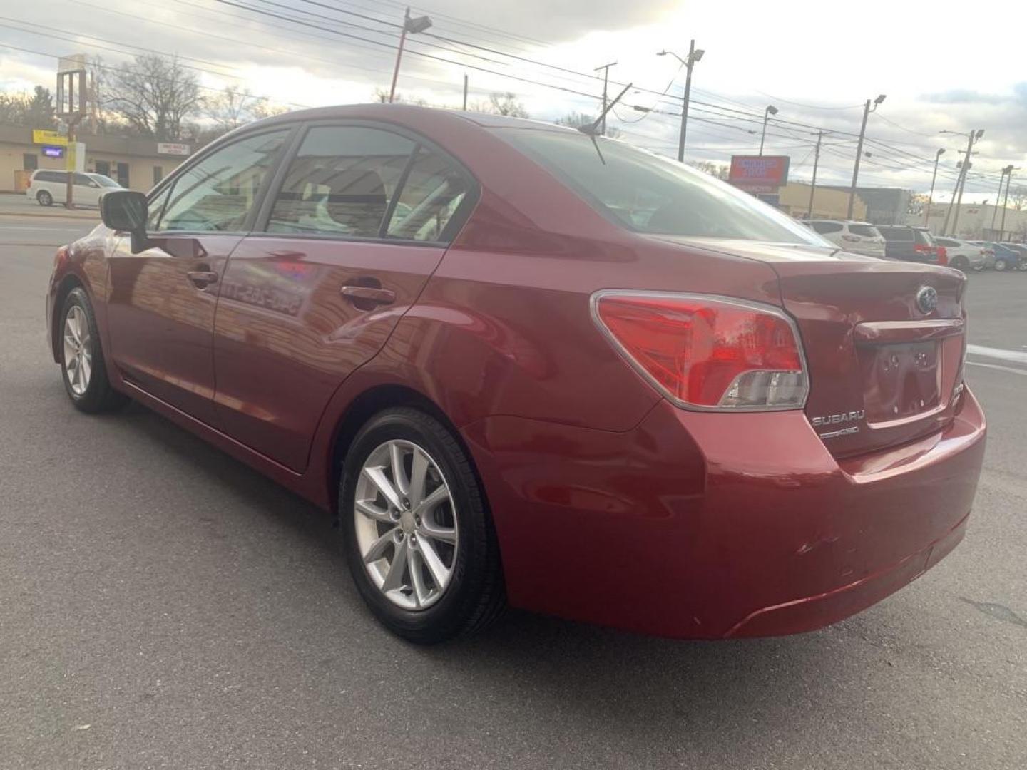 2012 RED SUBARU IMPREZA PREMIUM (JF1GJAB61CH) with an 2.0L engine, Continuously Variable transmission, located at 2514 Williamson Rd NE, Roanoke, VA, 24012, (540) 265-7770, 37.294636, -79.936249 - Photo#3