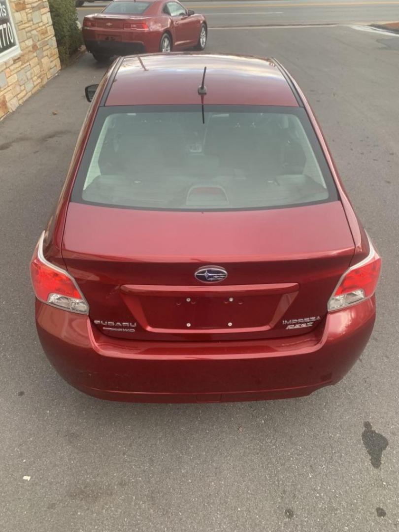 2012 RED SUBARU IMPREZA PREMIUM (JF1GJAB61CH) with an 2.0L engine, Continuously Variable transmission, located at 2514 Williamson Rd NE, Roanoke, VA, 24012, (540) 265-7770, 37.294636, -79.936249 - Photo#4