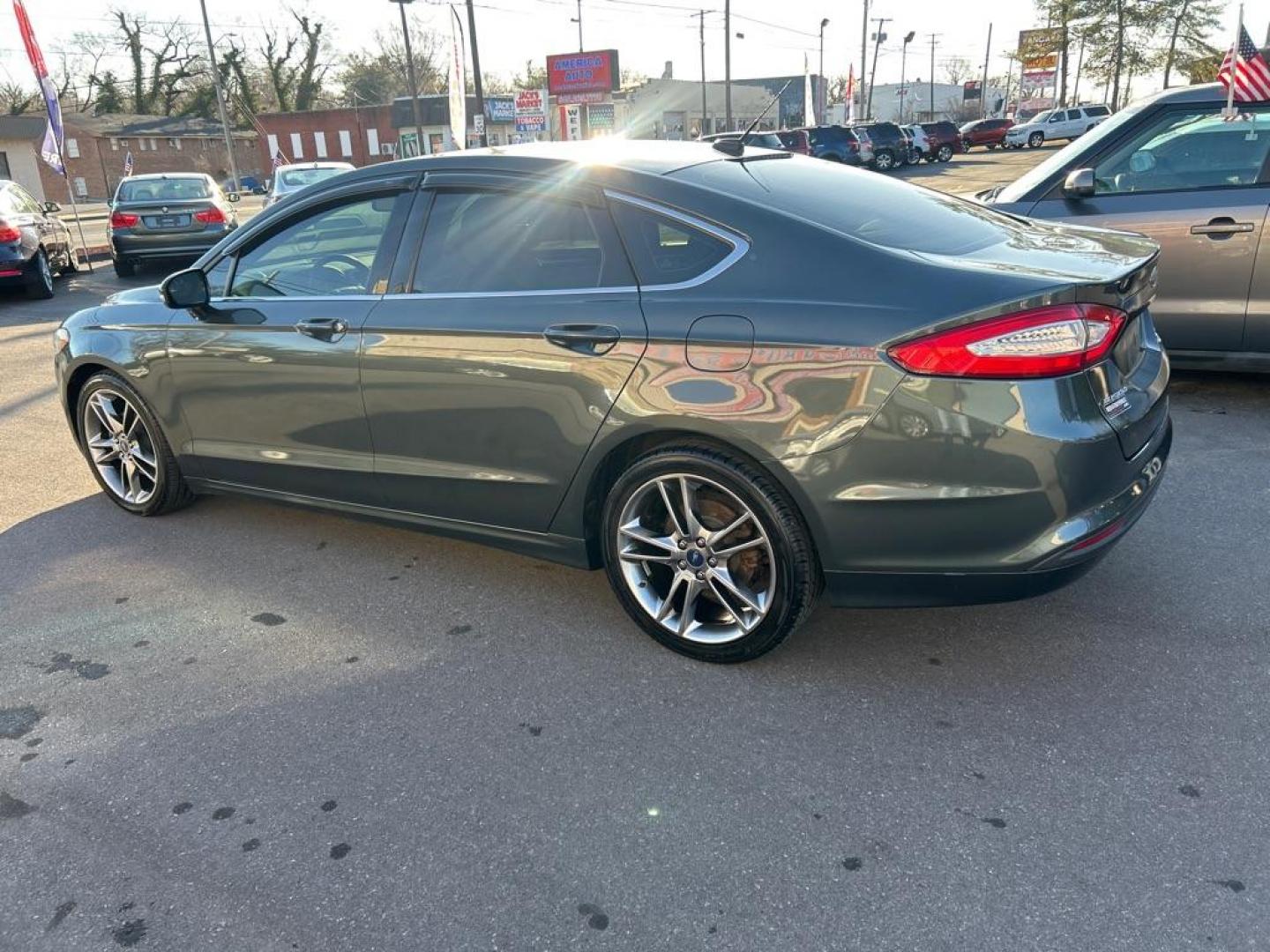 2015 GREEN FORD FUSION SE (3FA6P0HD5FR) with an 1.5L engine, Automatic transmission, located at 2514 Williamson Rd NE, Roanoke, VA, 24012, (540) 265-7770, 37.294636, -79.936249 - NO CREDIT CHECK FINANCING WITH ONLY $2700 DOWN PAYMENT!!!! Check out our website www.needausedvehicle.com for our No Credit Check/ In House Financing options!! No Credit Check Available!!! In House Financing Available!!! All Clean Title Vehicles (no Salvaged or flooded vehicles ever on our lot)! - Photo#1