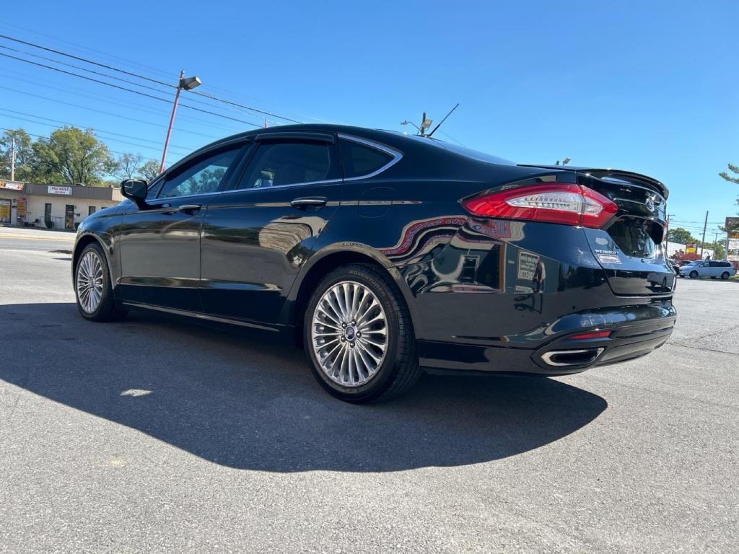 2016 BLACK FORD FUSION TITANIUM (3FA6P0K92GR) with an 2.0L engine, Automatic transmission, located at 2514 Williamson Rd NE, Roanoke, VA, 24012, (540) 265-7770, 37.294636, -79.936249 - Photo#1