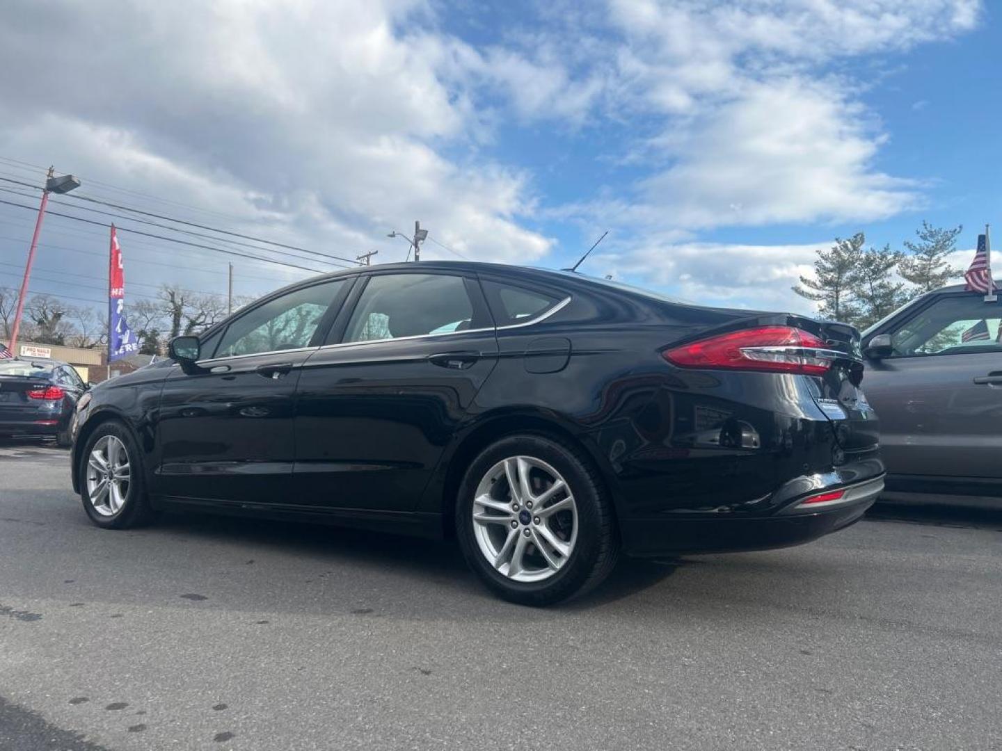 2018 BLACK FORD FUSION SE (3FA6P0HD4JR) with an 1.5L engine, Automatic transmission, located at 2514 Williamson Rd NE, Roanoke, VA, 24012, (540) 265-7770, 37.294636, -79.936249 - NO CREDIT CHECK FINANCING WITH ONLY $2700 DOWN PAYMENT!!!! Check out our website www.needausedvehicle.com for our No Credit Check/ In House Financing options!! No Credit Check Available!!! In House Financing Available!!! All Clean Title Vehicles (no Salvaged or flooded vehicles ever on our lot)! - Photo#1