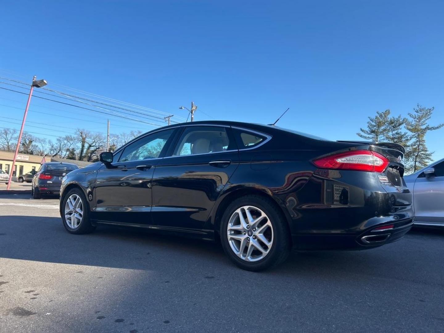 2016 BLACK FORD FUSION TITANIUM (3FA6P0K9XGR) with an 2.0L engine, Automatic transmission, located at 2514 Williamson Rd NE, Roanoke, VA, 24012, (540) 265-7770, 37.294636, -79.936249 - NO CREDIT CHECK FINANCING WITH ONLY $3000 DOWN PAYMENT!!!! Check out our website www.needausedvehicle.com for our No Credit Check/ In House Financing options!! No Credit Check Available!!! In House Financing Available!!! All Clean Title Vehicles (no Salvaged or flooded vehicles ever on our lot)! - Photo#1